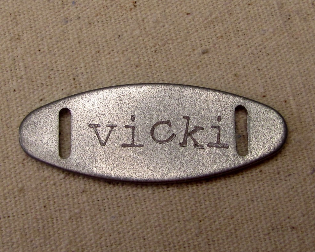 Button name plate