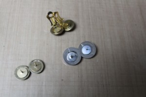 Glue earring backs or clips onto back of buttons; let dry.