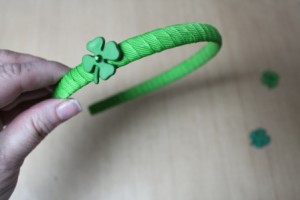 Glue clovers to headband starting on one side.
