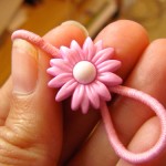 Ponytail holder made with a button