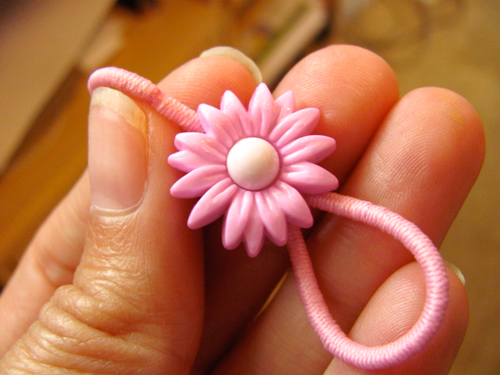 Ponytail holder made with a button