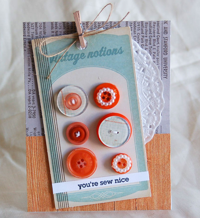 Vintage Buttons Blue Swirl Plastic Shank in Back Sewing Notion 3 Button Set Displayed on Free Spirit Fabric by Tim Holtz