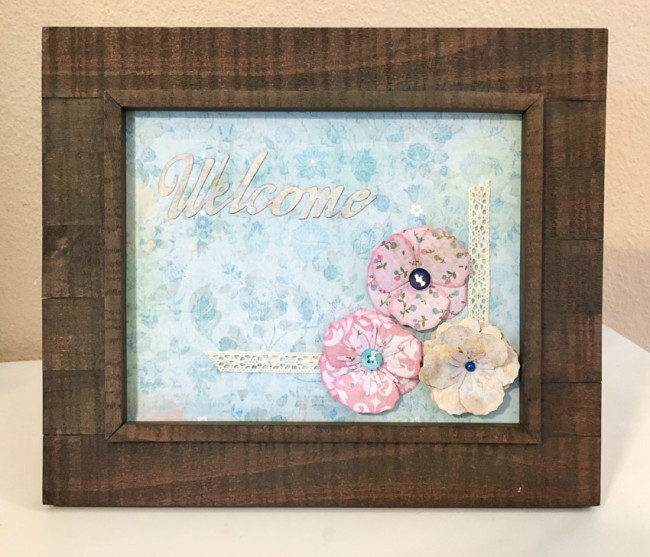 Welcome frame featuring 28 Lilac Lane products by May Flaum from Buttons Galore. Easy photo frame home decor project. 