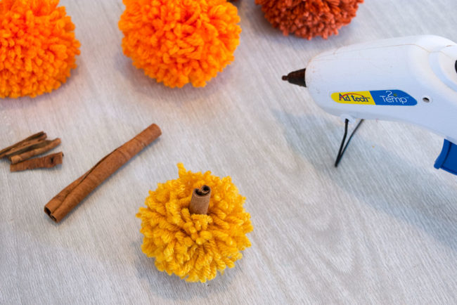 Pom Pom Pumpkins with Cinnamon Stick Stems