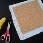 Cut fabric to fit cork board