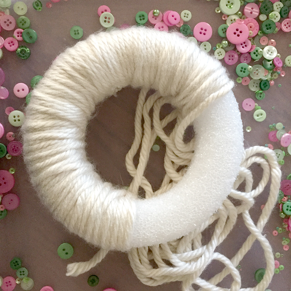 Brighten your Decor with a Yarn Wrapped Button Wreath!